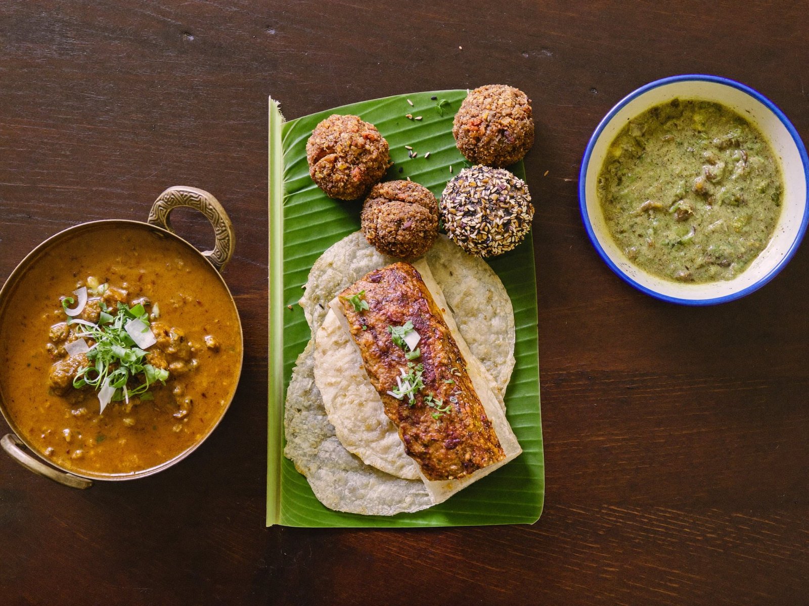 A home-style Kodava meal of pandi curry, akki rotti and kadumbuttu served on a banana leaf